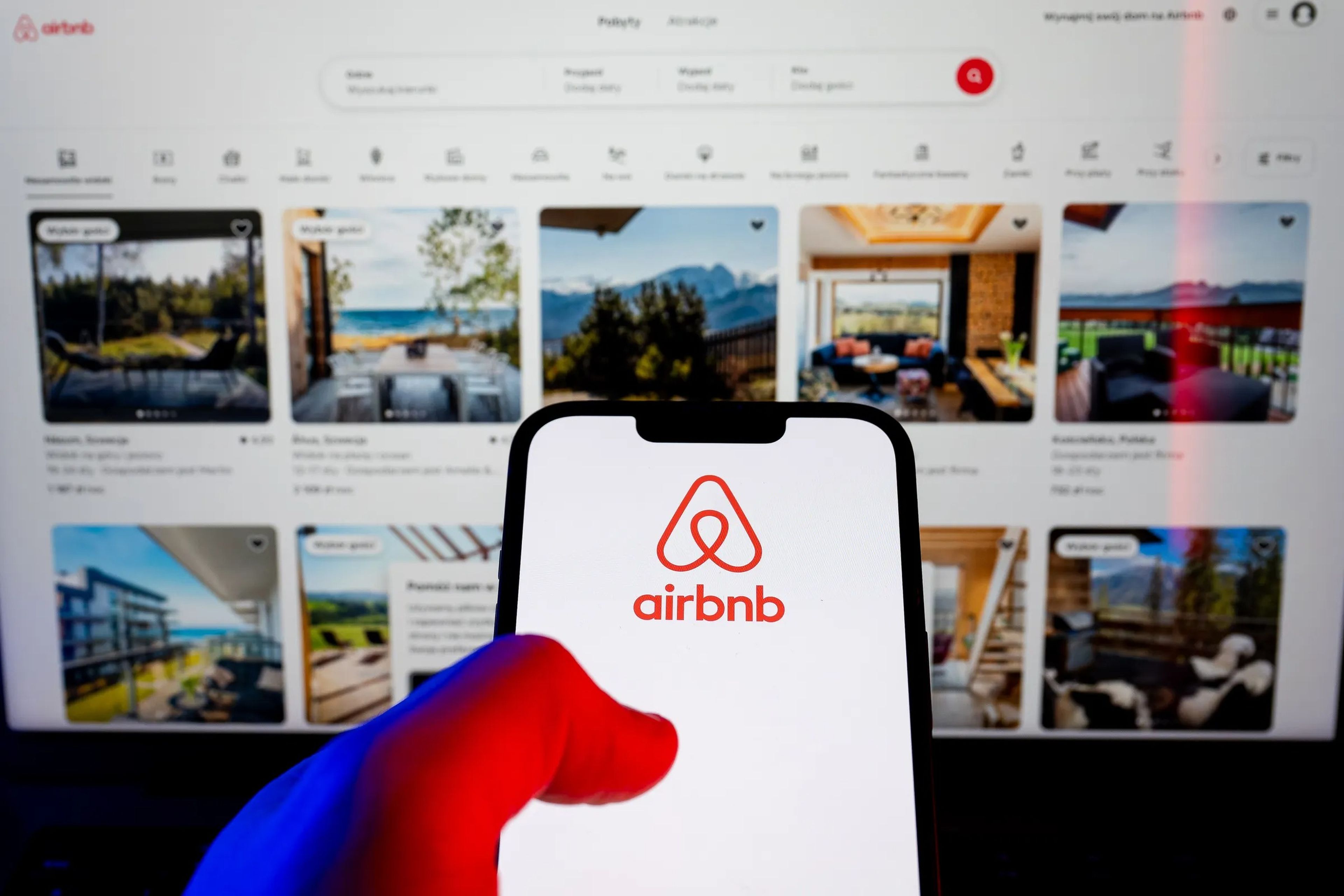 In this photo illustration, an Airbnb logo seen displayed on a smartphone.