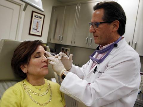 Howard Sobel, attending dermatologist and dermatologic surgeon at Lenox Hill Hospital in New York, demonstrates how Botox or other anti-wrinkle medicines are applied via syringe to a patient at his office in New York City March 22 Howard Sobel, attending dermatologist and dermatologic surgeon at Lenox Hill Hospital in New York, demonstrates how Botox or other anti-wrinkle medicines are applied via syringe to a patient at his office in New York City March 22