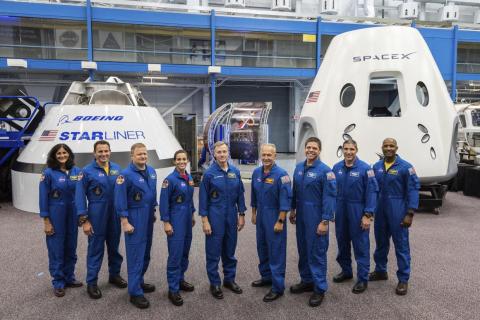 Astronauts assigned to Commercial Crew Program test flights stand in front of Boeing's CST-100 Starliner (left) and SpaceX's Crew Dragon (right).