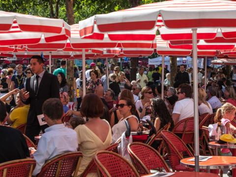 The terraces can be as crowded as the sidewalks. Travel + Leisure included the Champs Elysées on its list of the 95 most overrated attractions in the world, noting that apart from the view of the famous Arc de Triomphe and the