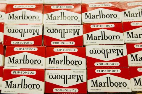 Boxes of confiscated cigarettes stand on a table at a news conference announcing an organized crime task force take down of an unstamped cigarette trafficking ring in New York.