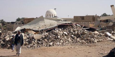 People walk past debris in Arhab, Yemen in January 2013 after a Houthi bomb was dropped there during a fight against Sunni tribesmen. People walk past debris in Arhab, Yemen in January 2013 after a Houthi bomb was dropped there during a fight against Sunni tribesmen.