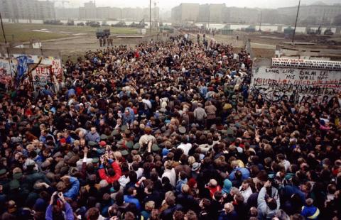 East Berliners cross and meet West Berliners at Potsdamer Platz after the Berlin Wall was torn down at this checkpoint November 12. Over 2 million people from East Berlin visited West Berlin just that weekend.
