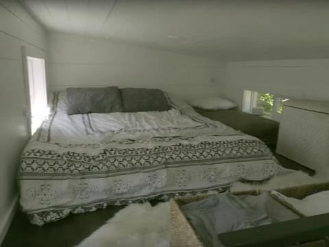 The bedroom is cozy.