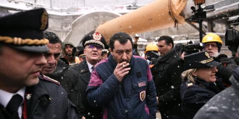 Italy's Interior Minister and deputy PM Matteo Salvini (C) smokes a cigarette during a visit to the building site of the TAV high-speed train line between Italy and France, on February 1, 2019 in Chiomonte, northwestern Italy. - Italy's Interior Minister and deputy PM Matteo Salvini (C) smokes a cigarette during a visit to the building site of the TAV high-speed train line between Italy and France, on February 1, 2019 in Chiomonte, northwestern Italy. -