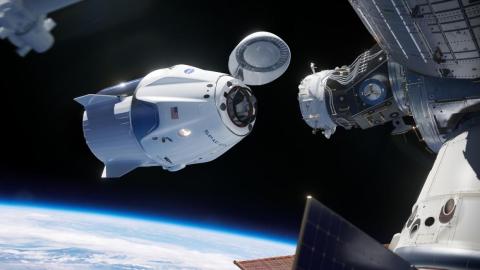 An illustration of SpaceX's Crew Dragon vehicle, a spaceship designed to fly NASA astronauts, docking with the International Space Station. An illustration of SpaceX's Crew Dragon vehicle, a spaceship designed to fly NASA astronauts, docking with the International Space Station.