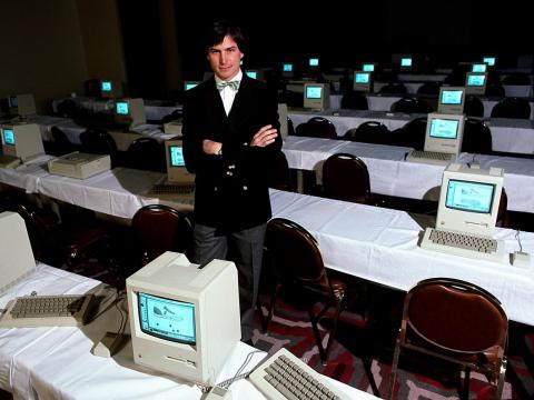 Late Apple CEO Steve Jobs surrounded by Macintosh computers. Late Apple CEO Steve Jobs surrounded by Macintosh computers.
