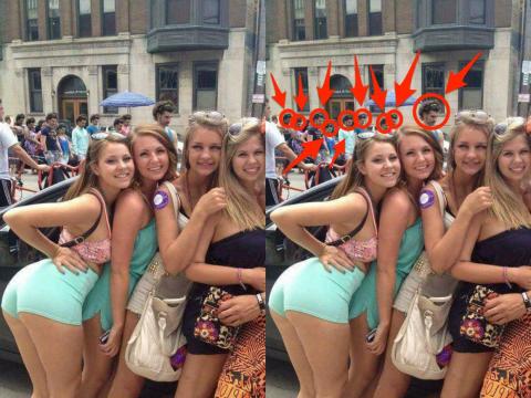 Most viewers miss the same-headed people in the background. Most viewers miss the same-headed people in the background.