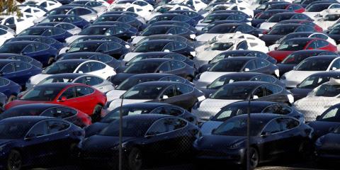A parking lot of predominantly new Tesla Model 3 electric vehicles in Richmond, California. A parking lot of predominantly new Tesla Model 3 electric vehicles in Richmond, California.