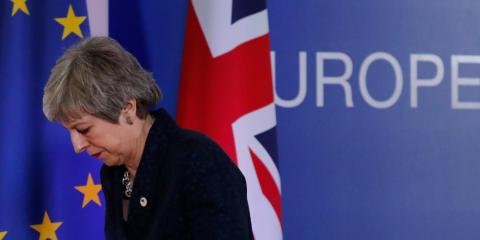 British Prime Minister Theresa May leaves after addressing a media conference at an EU summit in Brussels. British Prime Minister Theresa May leaves after addressing a media conference at an EU summit in Brussels.