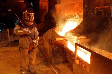 A worker monitors a process inside the plant at the copper refinery of Codelco Ventanas in Ventanas city, Chile. A worker monitors a process inside the plant at the copper refinery of Codelco Ventanas in Ventanas city, Chile.