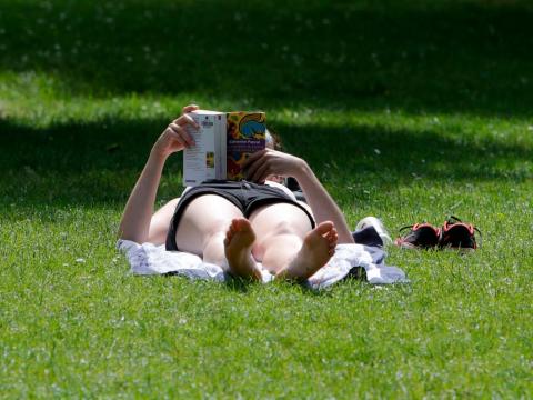 A woman in a park Monday in Lille, northern France.