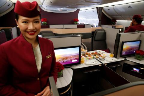 A Qatar Airways crew member. A Qatar Airways crew member.