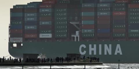 Onlookers watch from a harbor wall as the largest container ship in world, CSCL Globe, docks during its maiden voyage, at the port of Felixstowe in south east England, Jan. 7, 2015. Onlookers watch from a harbor wall as the largest container ship in world, CSCL Globe, docks during its maiden voyage, at the port of Felixstowe in south east England, Jan. 7, 2015.
