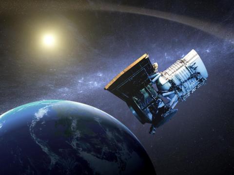 An artist's concept shows the Wide-field Infrared Survey Explorer in orbit around Earth.