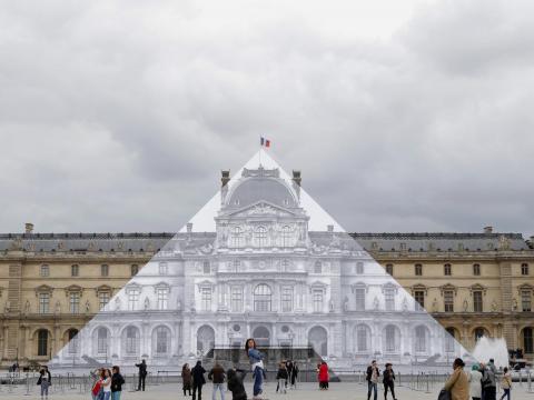 One of JR's most well-known projects was transforming the Louvre in Paris into a giant optical illusion. One of JR's most well-known projects was transforming the Louvre in Paris into a giant optical illusion.