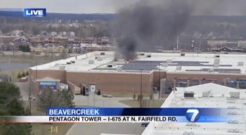 Local news channels show a fire at a Walmart in Beavercreek, Ohio, in March 2018.