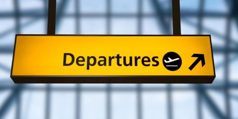 A sign for departures at Gatwick Airport, UK. A sign for departures at Gatwick Airport, UK.