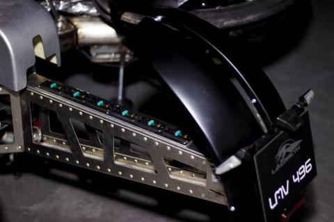 Body work for this experimental vehicle is made of a carbon kevlar composite.
