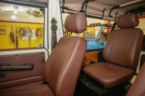 This white finish contrasts the interior brown vinyl.