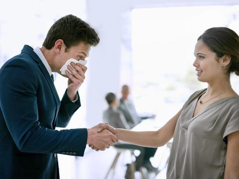 This year, some companies are telling their employees to avoid handshakes and hugs.
