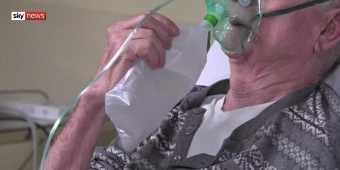 A man with a respiratory aid at the hospital in Bergamo.