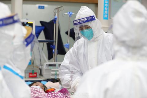 Pictures uploaded to social media on January 25, 2020 by the Central Hospital of Wuhan show medical staff attending to a patient, in Wuhan, China.
