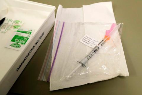 A syringe containing the first shot given in the trial.