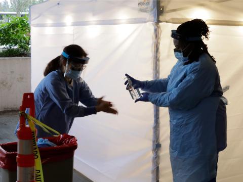 Nurses at a testing station in Seattle on Friday.