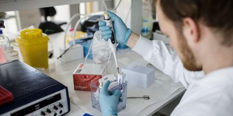 A researcher works on a coronavirus vaccine at the University of Copenhagen's research lab on March 23, 2020.