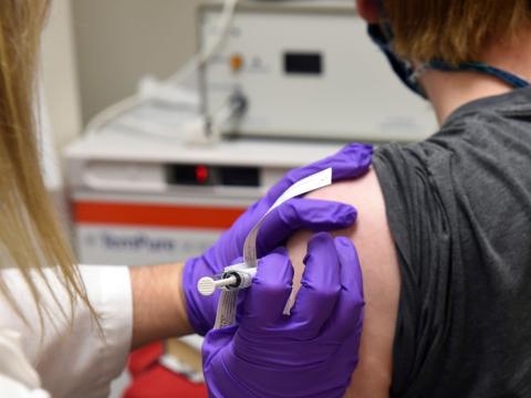 The first patient enrolled in Pfizer's coronavirus vaccine clinical trial at the University of Maryland School of Medicine in Baltimore, receives an injection, May 4, 2020.
University of Maryland School of Medicine/AP Photo
