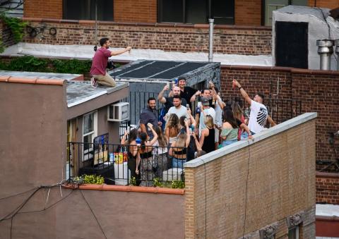 People party on a rooftop on August 1, 2020, in New York City.
Noam Galai/Getty Images