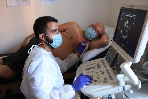 Roberto Bruzzone, a 57-year-old coronavirus patient, has an ultrasound at the Department of Rehabilitative Cardiology in Genoa, Italy, on July 22, 2020.
Marco Di Lauro/Getty Images