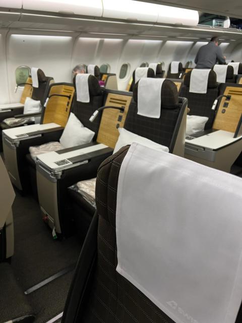 a photo of a mostly empty business-class section on a plane