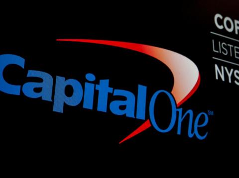 The logo and ticker for Capital One are displayed on a screen on the floor of the NYSE in New York The logo and ticker for Capital One are displayed on a screen on the floor of the NYSE in New York