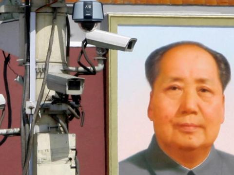 Surveillance cameras in front of the giant portrait of Chairman Mao Zedong at Beijing's Tiananmen Square in September 2009. China is increasingly monitoring on citizens' behavior. Surveillance cameras in front of the giant portrait of Chairman Mao Zedong at Beijing's Tiananmen Square in September 2009. China is increasingly monitoring on citizens' behavior.