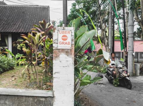 Signs dictating certain areas as "no-go" zones for Uber, Grab, and other ride-sharing services are all over Bali. Signs dictating certain areas as "no-go" zones for Uber, Grab, and other ride-sharing services are all over Bali.
