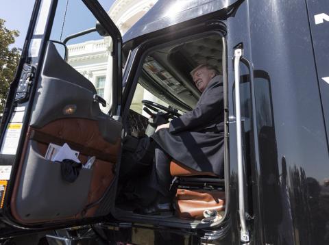 President Donald Trump sits in a truck. President Donald Trump sits in a truck.