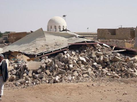 People walk past debris in Arhab, Yemen in January 2013 after a Houthi bomb was dropped there during a fight against Sunni tribesmen. People walk past debris in Arhab, Yemen in January 2013 after a Houthi bomb was dropped there during a fight against Sunni tribesmen.