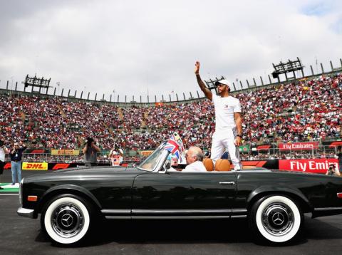 Lewis Hamilton in a vintage Merc. Lewis Hamilton in a vintage Merc.