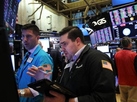 Traders work on the floor of the New York Stock Exchange earlier this week. Traders work on the floor of the New York Stock Exchange earlier this week.