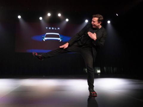 Tesla CEO Elon Musk shows off his sneakers before introducing Tesla's new Model Y in March 2019. Tesla CEO Elon Musk shows off his sneakers before introducing Tesla's new Model Y in March 2019.