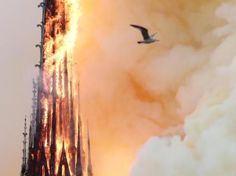 Smoke billows as fire engulfs the spire of Notre Dame Cathedral in Paris, France April 15, 2019. Smoke billows as fire engulfs the spire of Notre Dame Cathedral in Paris, France April 15, 2019.