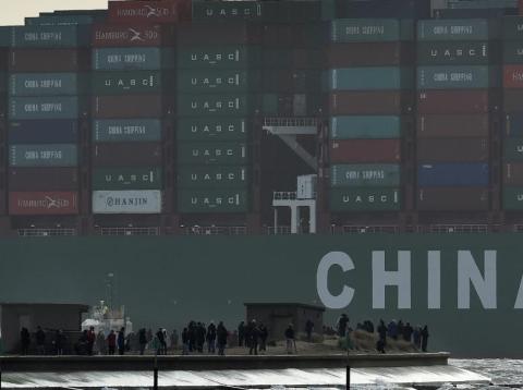 Onlookers watch from a harbor wall as the largest container ship in world, CSCL Globe, docks during its maiden voyage, at the port of Felixstowe in south east England, Jan. 7, 2015. Onlookers watch from a harbor wall as the largest container ship in world, CSCL Globe, docks during its maiden voyage, at the port of Felixstowe in south east England, Jan. 7, 2015.