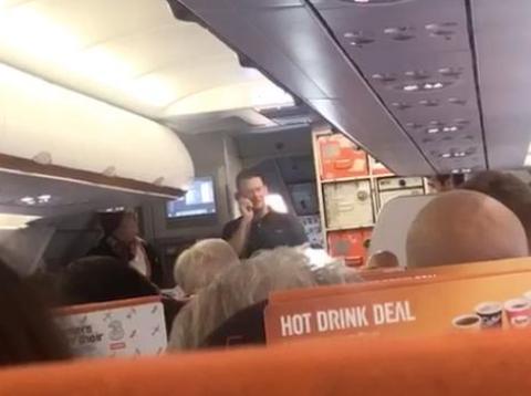 A video posted to Facebook showed the off-duty EasyJet pilot Michael Bradley telling passengers he's going to fly the plane himself. A video posted to Facebook showed the off-duty EasyJet pilot Michael Bradley telling passengers he's going to fly the plane himself.