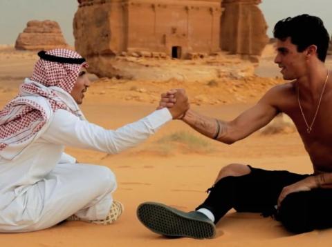 The Instagram star Jay Alvarrez with a Saudi man wearing a keffiyeh and thawb at Saudi Arabia's heritage center of Mada'in Saleh. The Instagram star Jay Alvarrez with a Saudi man wearing a keffiyeh and thawb at Saudi Arabia's heritage center of Mada'in Saleh.