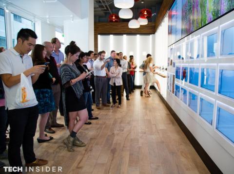 Customers wait to pick up their Eatsa orders from the automat's futuristic pickup windows in San Francisco in 2016. Customers wait to pick up their Eatsa orders from the automat's futuristic pickup windows in San Francisco in 2016.