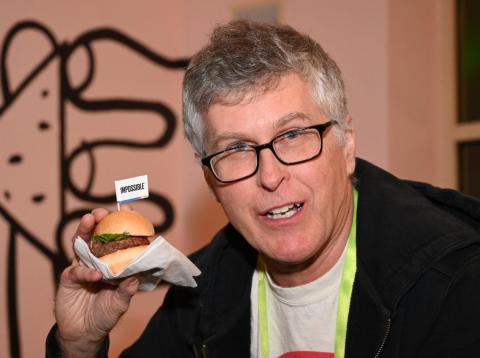 Impossible Foods CEO Pat Brown holds up an Impossible Burger 2.0, the new and improved version of the company's plant-based vegan burger that tastes like real beef. Impossible Foods CEO Pat Brown holds up an Impossible Burger 2.0, the new and improved version of the company's plant-based vegan burger that tastes like real beef.