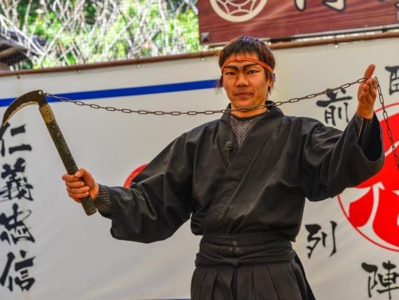 A man wearing a ninja costume and teaching at the Ninja School in Iga City, Japan.