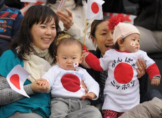 Japanese fans and their babies cheer prior to the AFC Asian Cup Group B match between Saudi Arabia and Japan at Al-Rayyan Stadium on January 17, 2011 in Doha, Qatar.